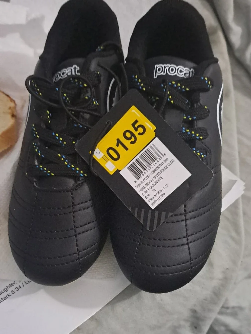 Puma Kids Black Soccer Cleats with Yellow Sole and Blue Studs